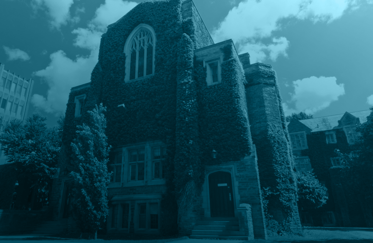 Gothic-style campus building with ivy-covered brick walls